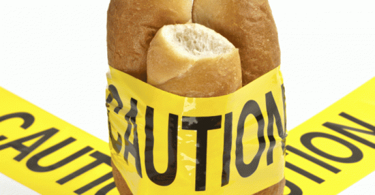 Caution tape wrapped around baguettes
