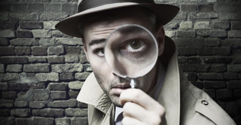 Detective with a magnifying glass