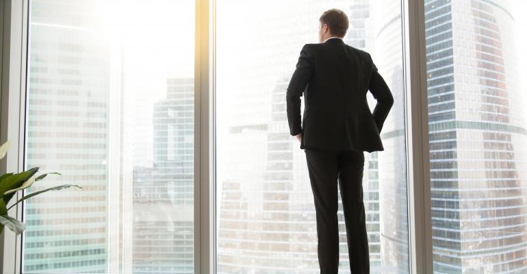 Businessman looking out window