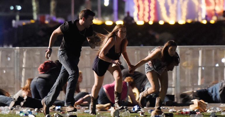 People run from gun fire at a Las Vegas country music festival