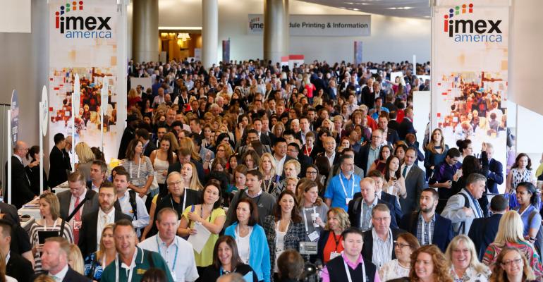 The crowd surges onto the show floor on opening day of IMEX America 2016