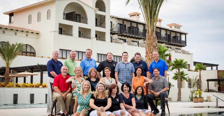 The IRF board of trustees with the Secrets Puerto Los Cabos host property in the background were ready to welcome this year39s Invitational participants