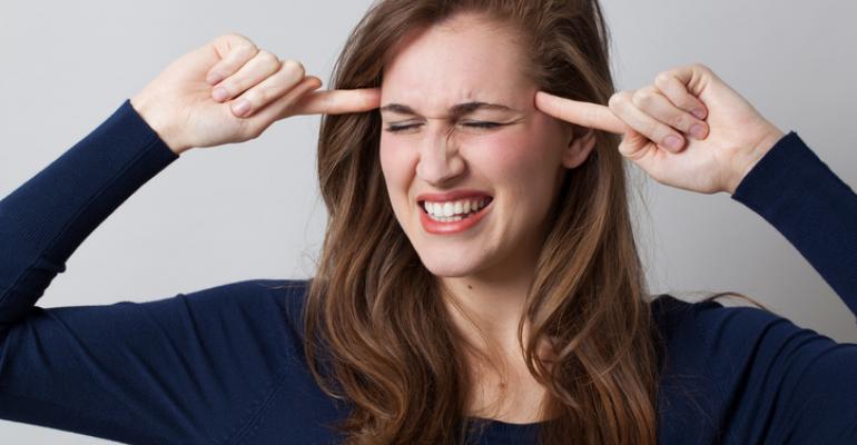 Woman pointing to her head