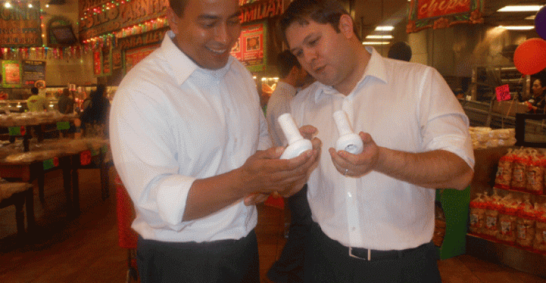 Two men examine spirometers at a American College of Chest Physicians Phoenix Lung Health Day activity