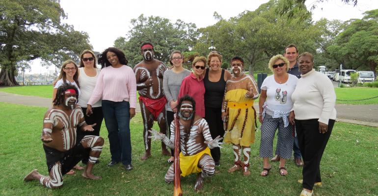 After arriving in Sydney participants were welcomed with a performance by the aboriginal dance company Descendance at the scenic city park Mrs Macquariersquos Chair With the dancers from left Samantha Holmes North America Tourism Australia Andrea HenningBeavon CMP Down to the Details Bayo Sharp HelmsBriscoe Danielle Childress CPI Regina Baraban MeetingsNet Cindy LoPatriello VIP Incentives Christianne Heba Meetings Unlimited Steven Dixon Tourism New Zealand and Gwendolyn Moore Ford Motor Co 