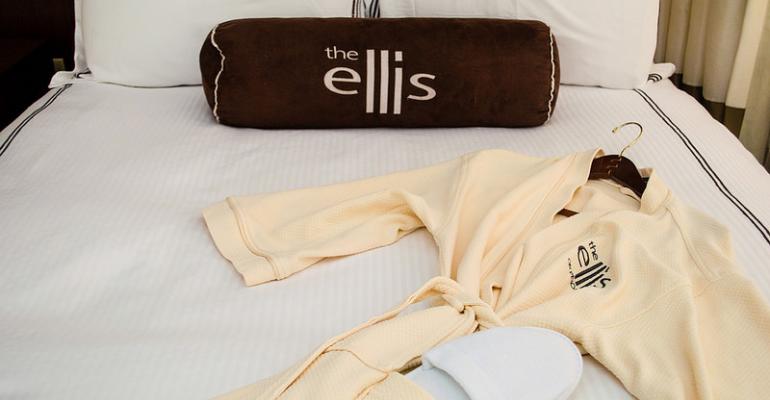 A bed in a room on the refurbished Ellis Hotel39s WomensOnly floor