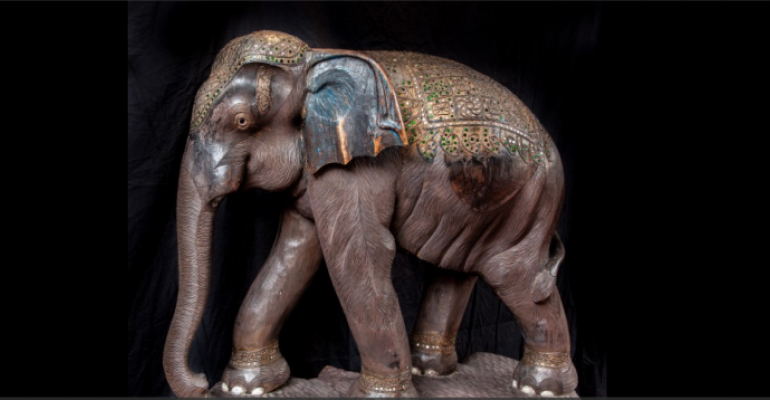 The sculptured wooden elephant in Atrium I represents a beloved Thai talisman and a lovely backdrop for some Thai food during an art dinearound at the Hilton Anatole in Dallas 