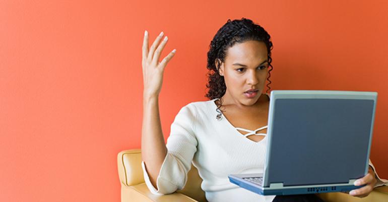 Mad girl looking at laptop