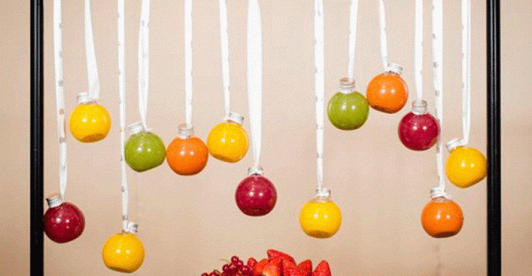 Hanging juice bottles from a picture frame