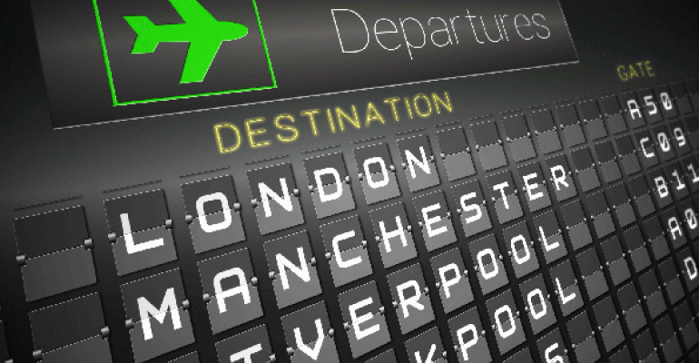 Airport departure board listing UK flights