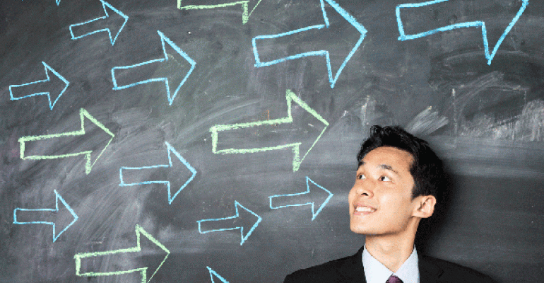 Man with arrows on a blackboard