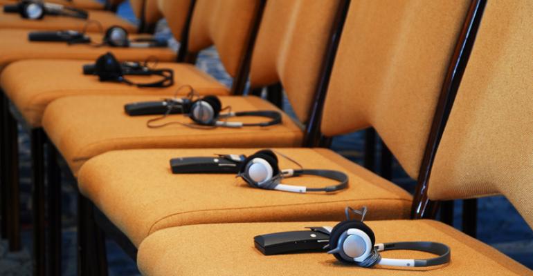 Translation headsets on row of chairs