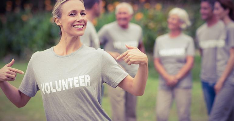 A volunteer shows off her t-shirt