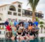 The IRF board of trustees with the Secrets Puerto Los Cabos host property in the background were ready to welcome this year39s Invitational participants