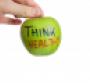 Hand holding apple with think healthy written on it