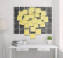 Office with wall calendar covered in PostIt notes