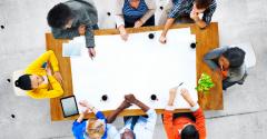 People sitting around a table at a meeting