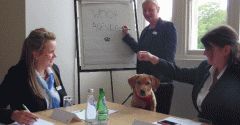 Russell the Labrador presiding over a meeting