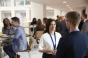 People chatting during a meeting coffee break