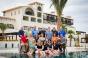 The IRF board of trustees with the Secrets Puerto Los Cabos host property in the background were ready to welcome this year39s Invitational participants