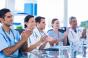 Physicians applauding at a meeting