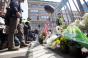 People leave flowers and flags to honor those injured and killed by the Boston Marathon bombing