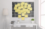 Office with wall calendar covered in PostIt notes