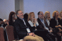 People laughing at a conference
