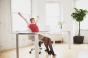 Woman at desk stretching