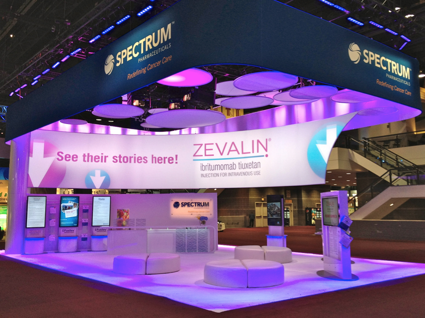 We added flat-panel monitors to this Spectrum Pharmaceuticals exhibit booth so customers could view and interact with information about the company. Also, what one may think is a banner is actually a blended projection screen—we used digital signage to interact with the graphics.