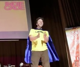 Myles Nye, game master, on stage at IndieCade